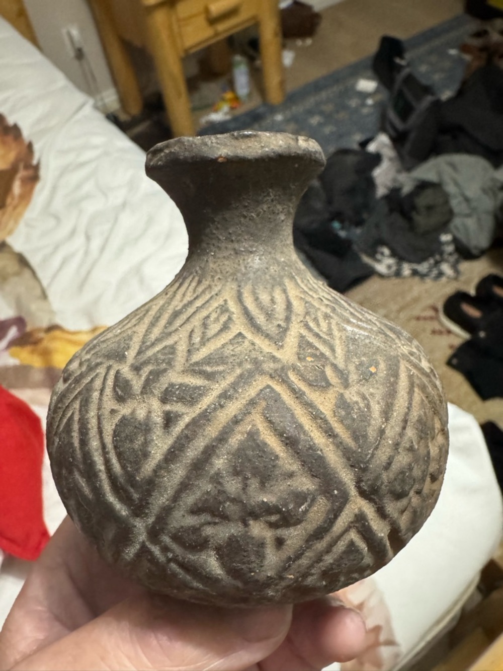 Vintage pottery vessel Cambodia. Khmer style and time period.